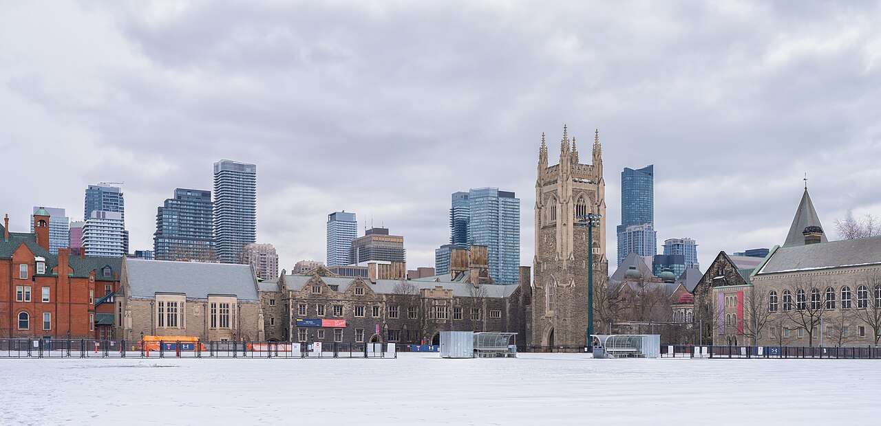 Soldiers' Tower and University of Toronto buildings across a snow-covered field, with towers behind